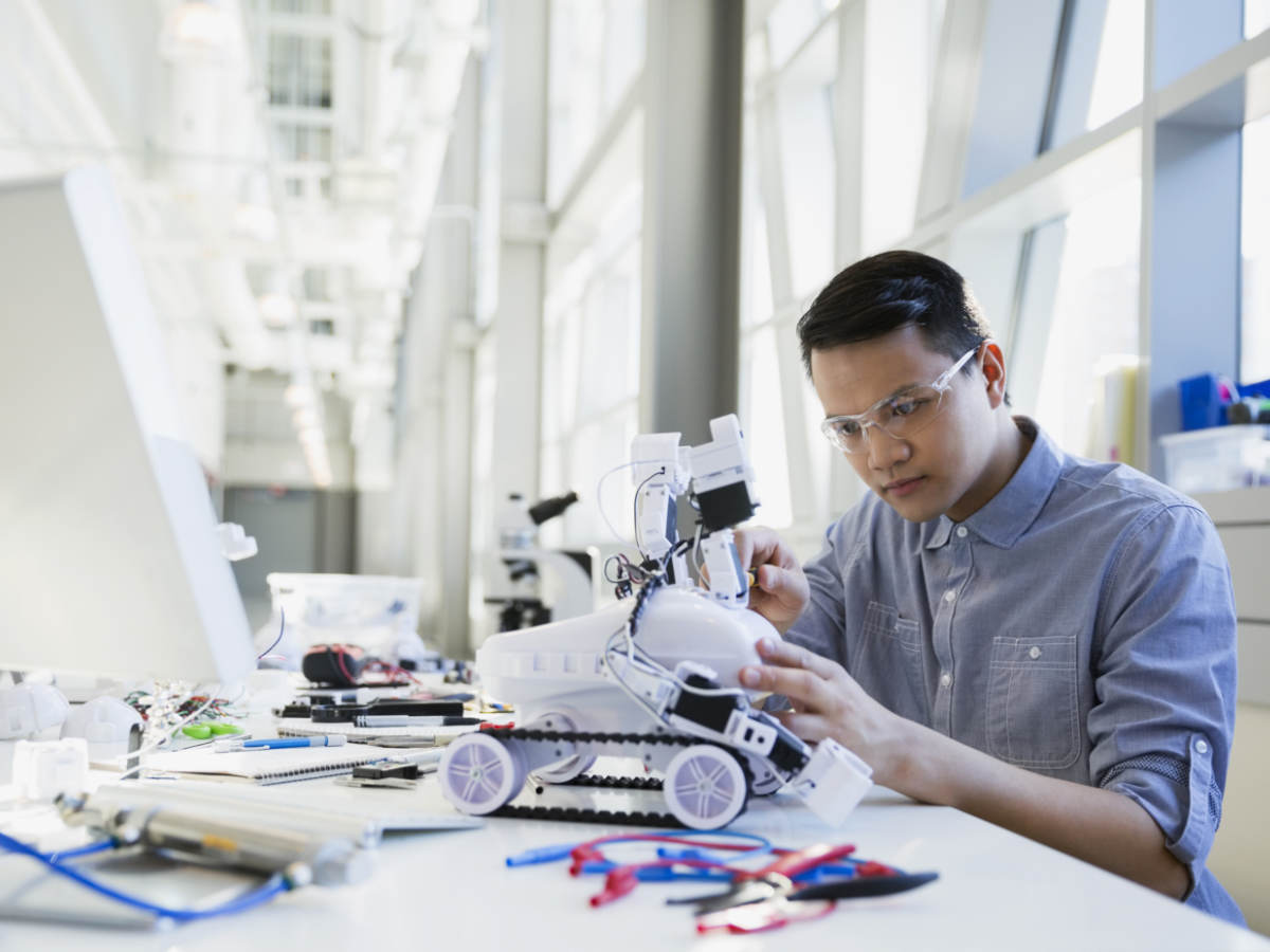 Engineer assembling robotic car