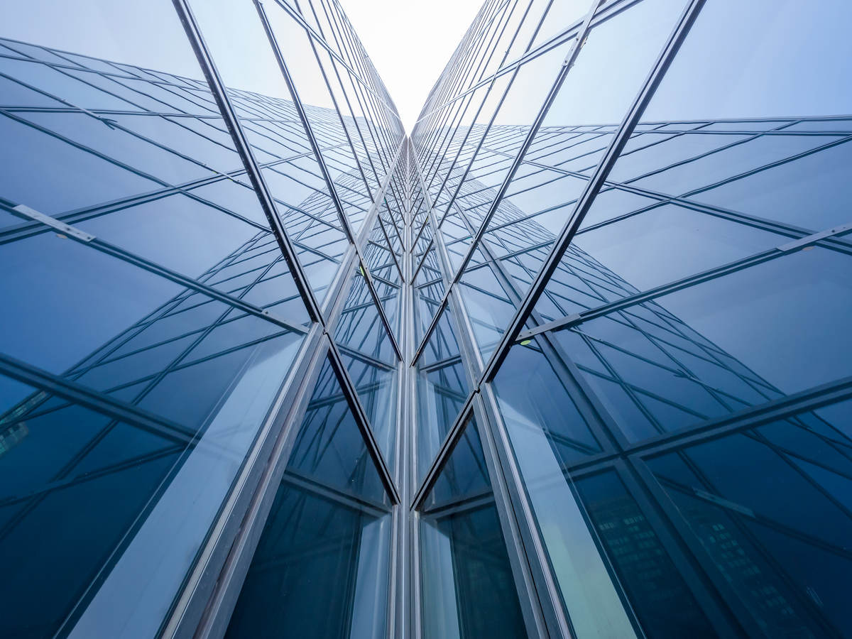 Modern blue glass building mirror reflections