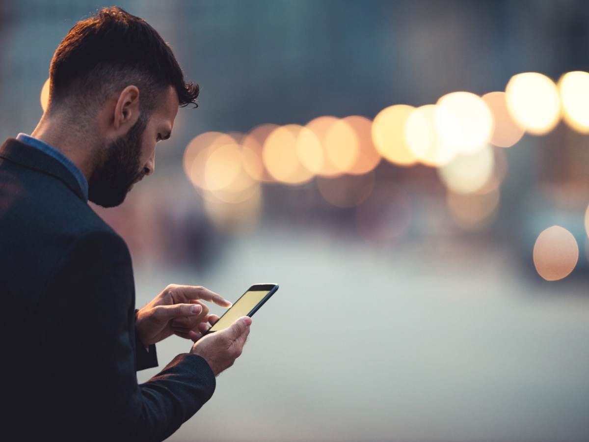 man checking smartphone