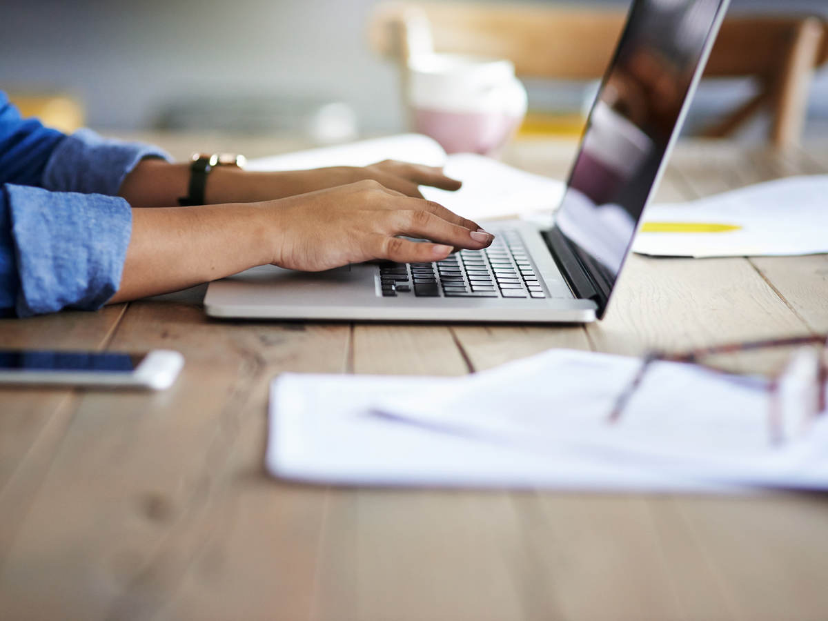 Person sitting at her desk receiving training