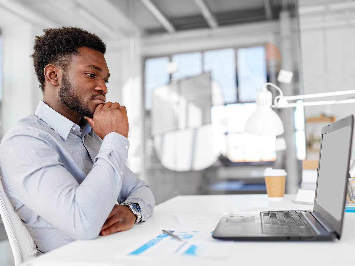 Man sitting in front of computer doing online training