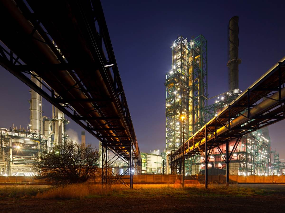 Pipelines at refinery at night