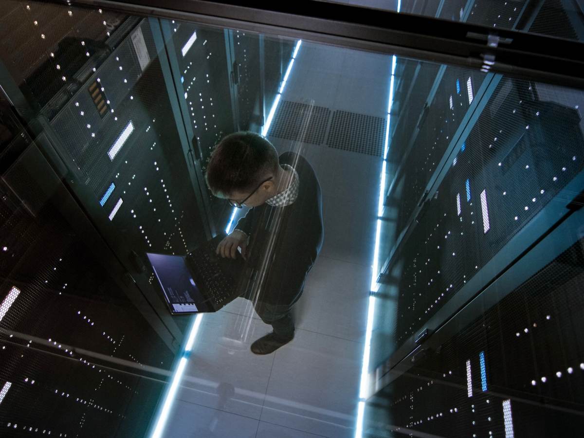 Top down view of man working in a data center 