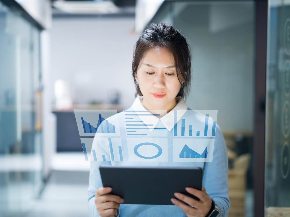 Businesswoman using virtual visual screen