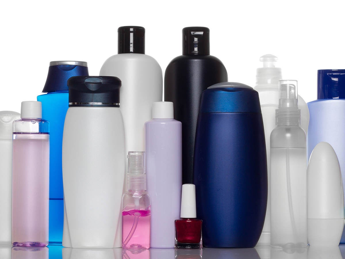 Cosmetic bottles on stand 