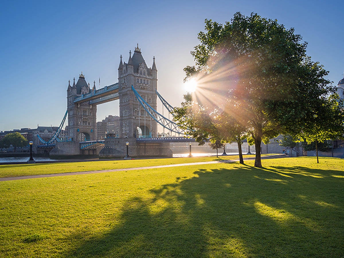 View of London bridge with sun rays in the background.