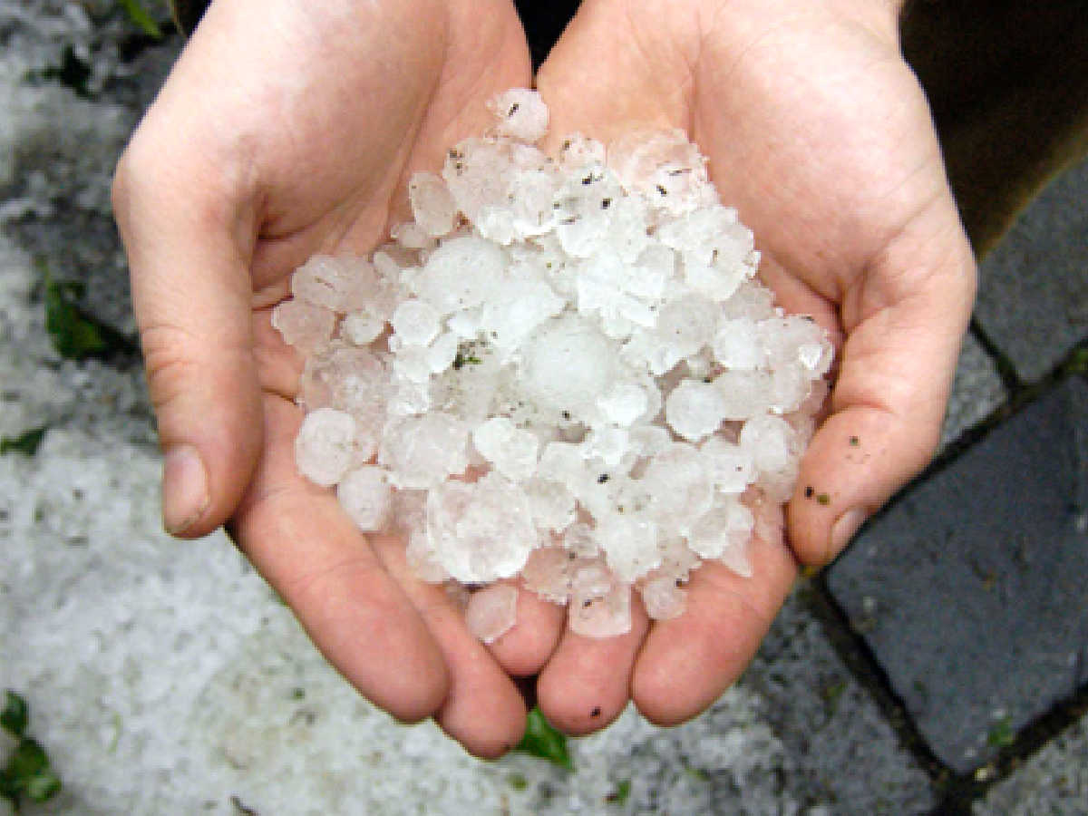 Two hands holding hail stones