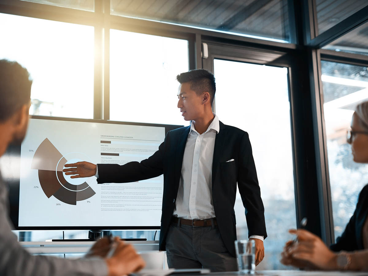 young businessman giving a presentation to his colleagues