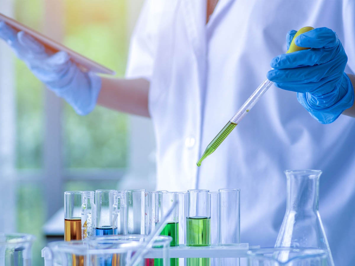 Scientist working in a chemical laboratory and using test tubes