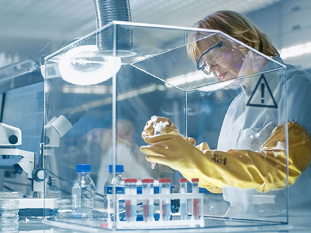 scientist in lab mixing chemicals 