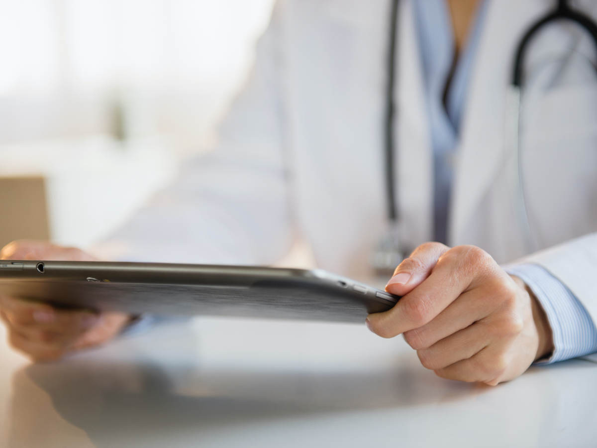 Doctor looking at a tablet