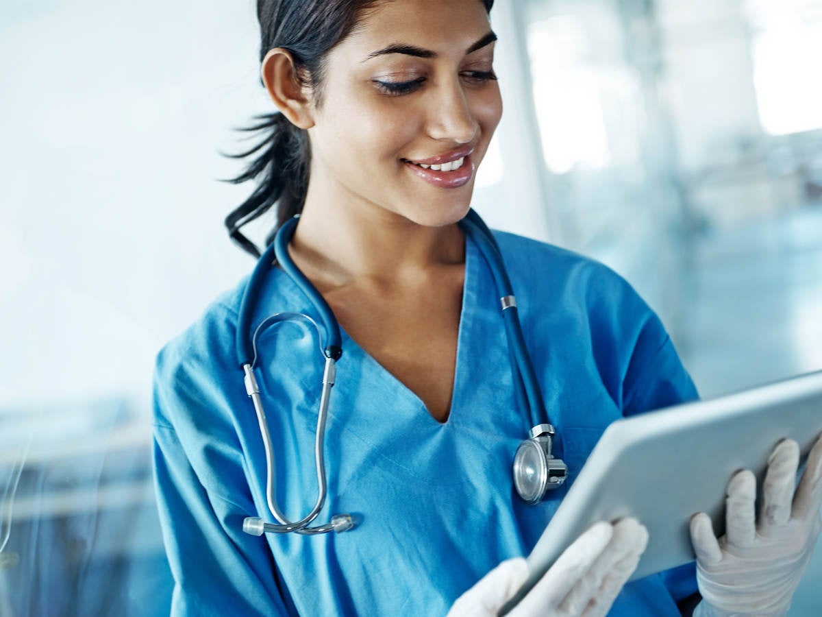 Nurse looking at a tablet