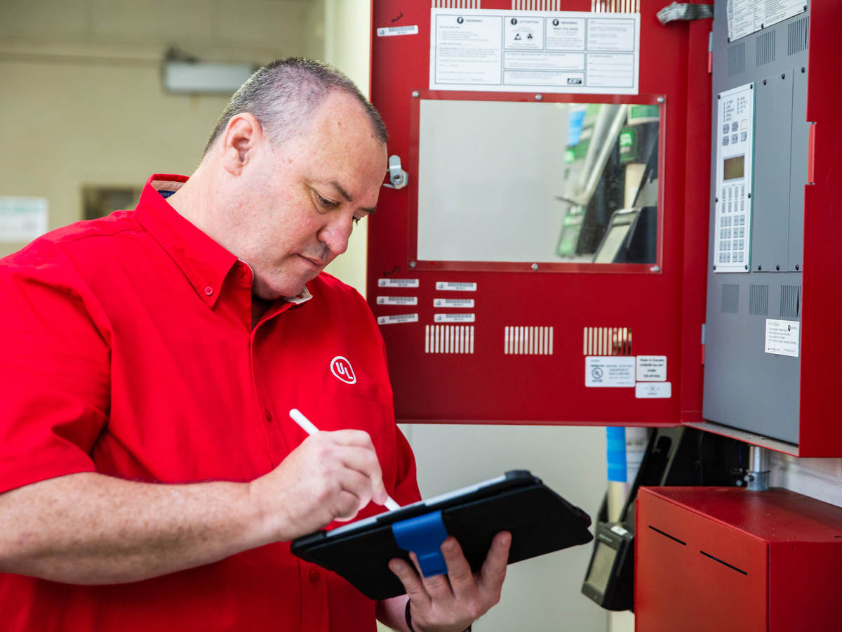 UL employee checking a fire alarm system