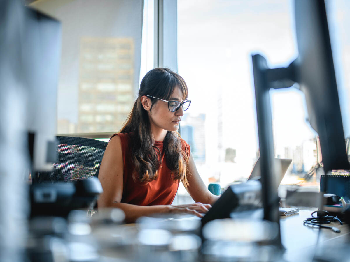 businesswoman using a laptop computer at office