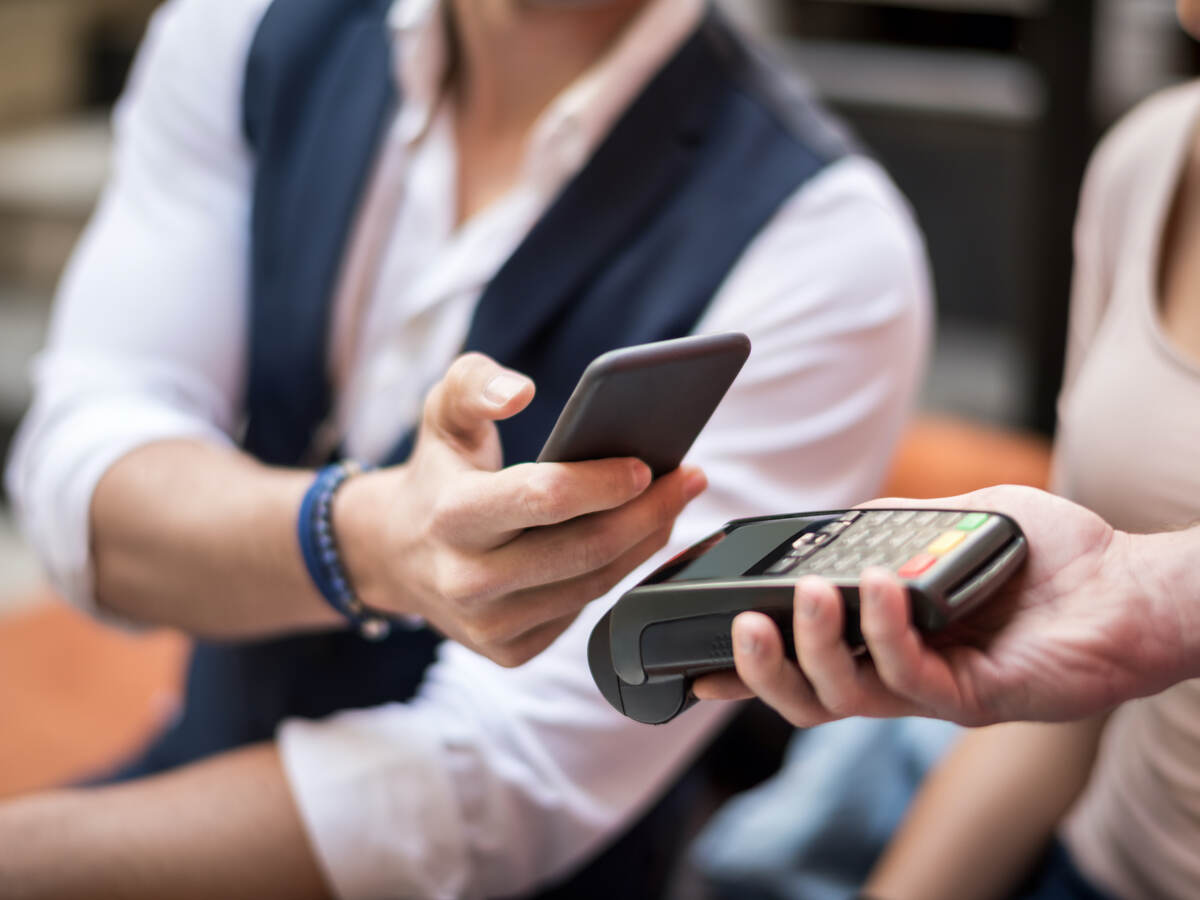 man using a mobile phone for payment