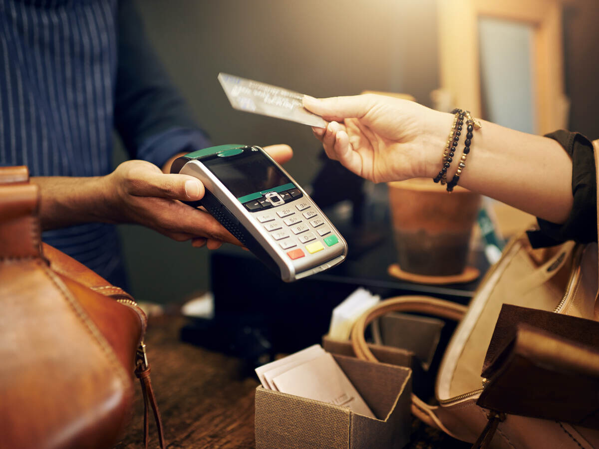 woman holding a credit card for payment