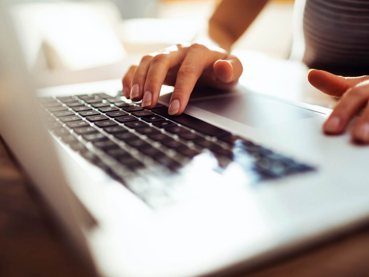 woman typing a laptop computer