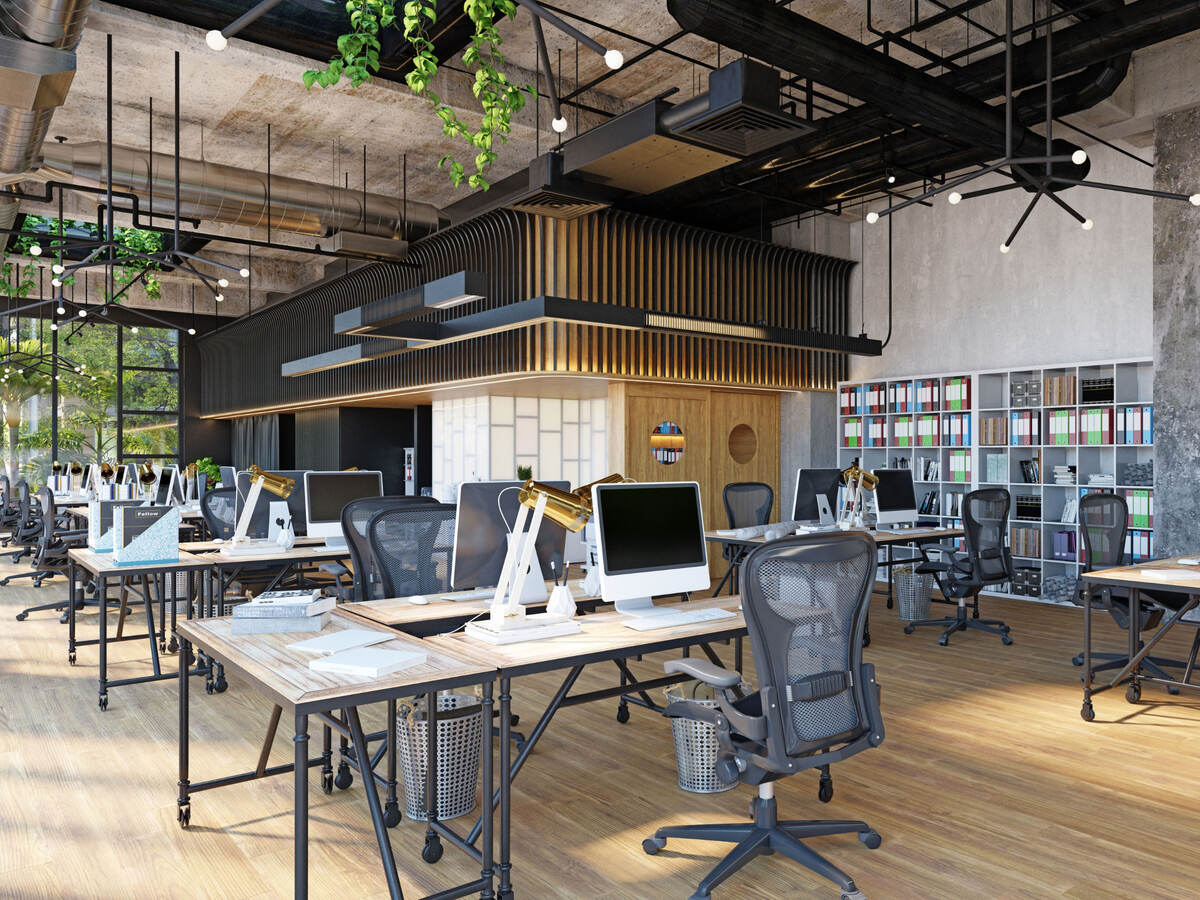 Row of empty desks in a modern office