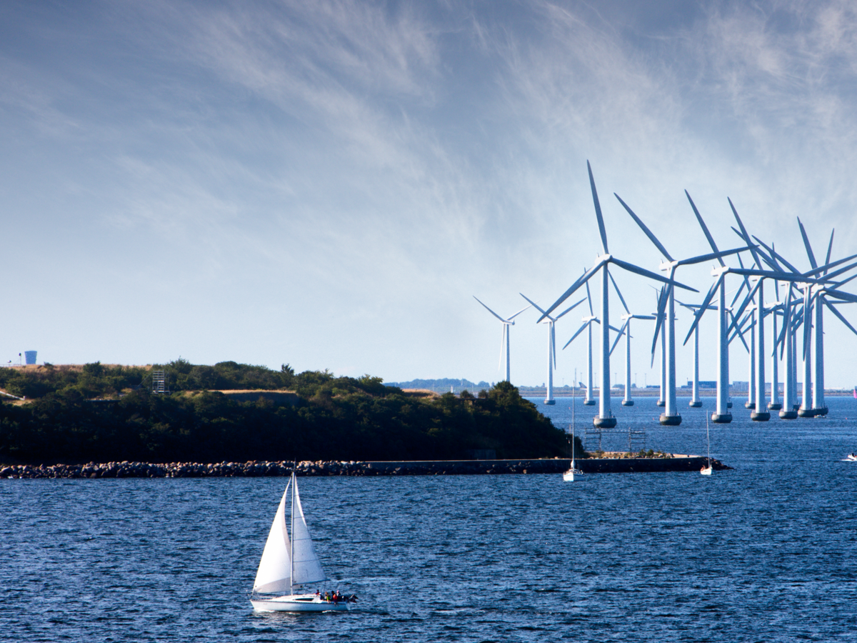 Wind turbines at sea with boat