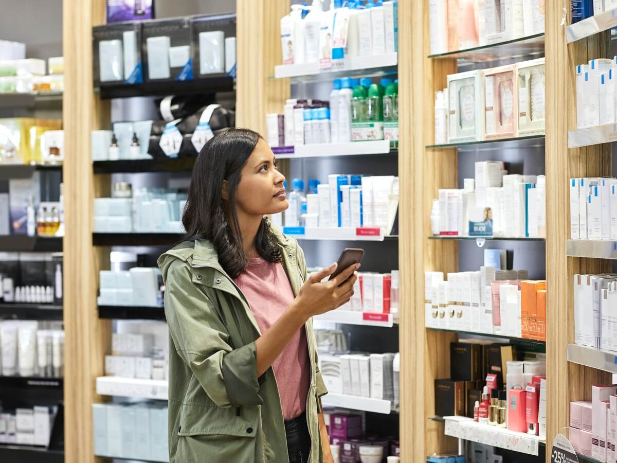 Woman shopping shelves of products.