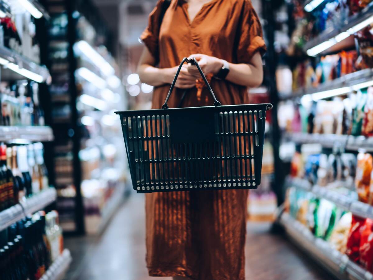 Woman carrying a shopping basket