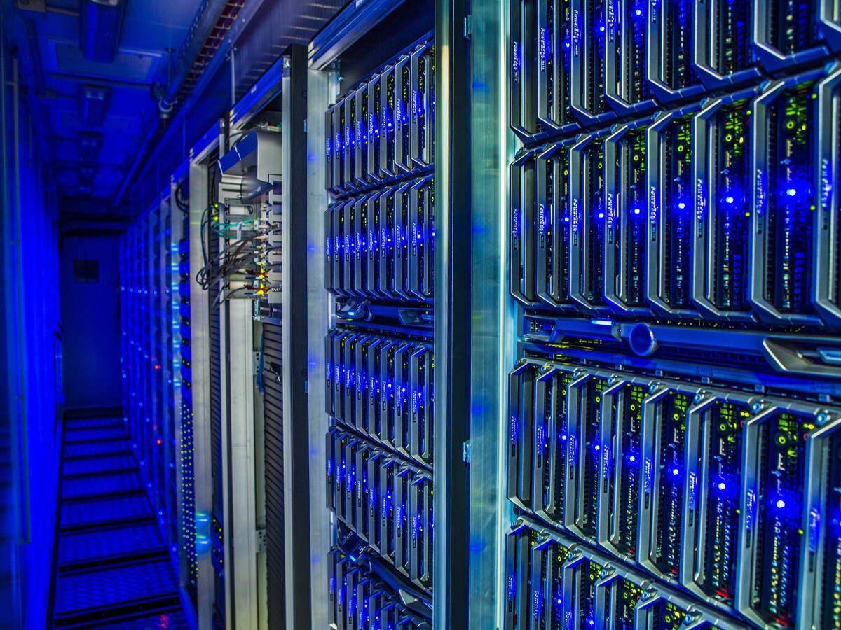 Interior of data center with equipment trimmed in blue LED lighting