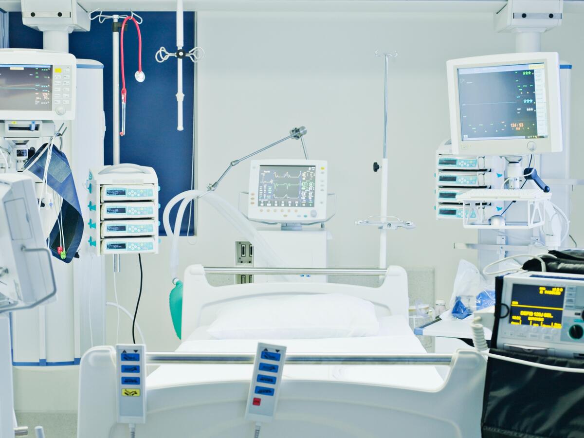 Empty hospital bed in intensive care
