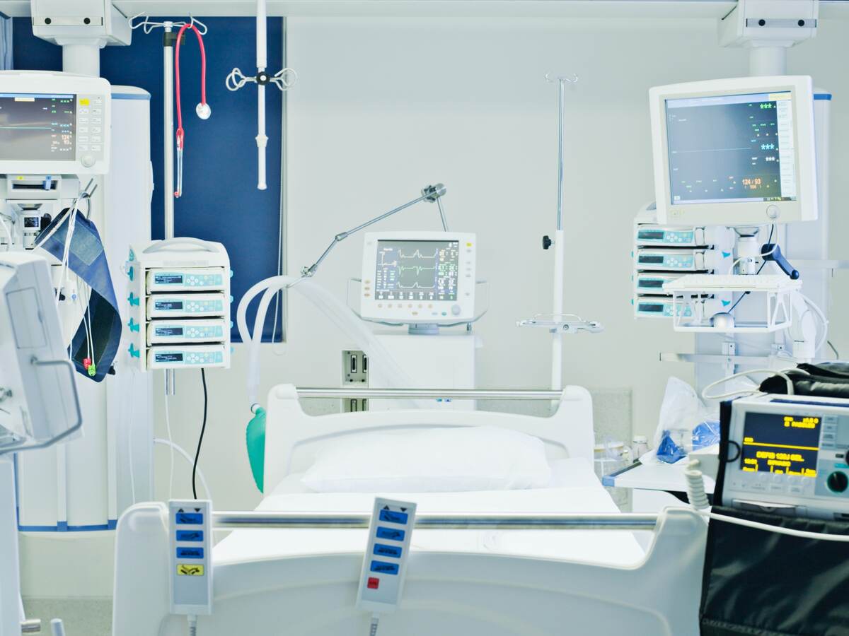 Empty hospital bed in intensive care