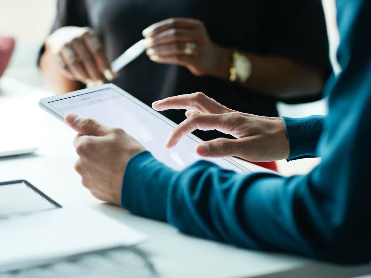 Person holding a tablet meeting with a customer