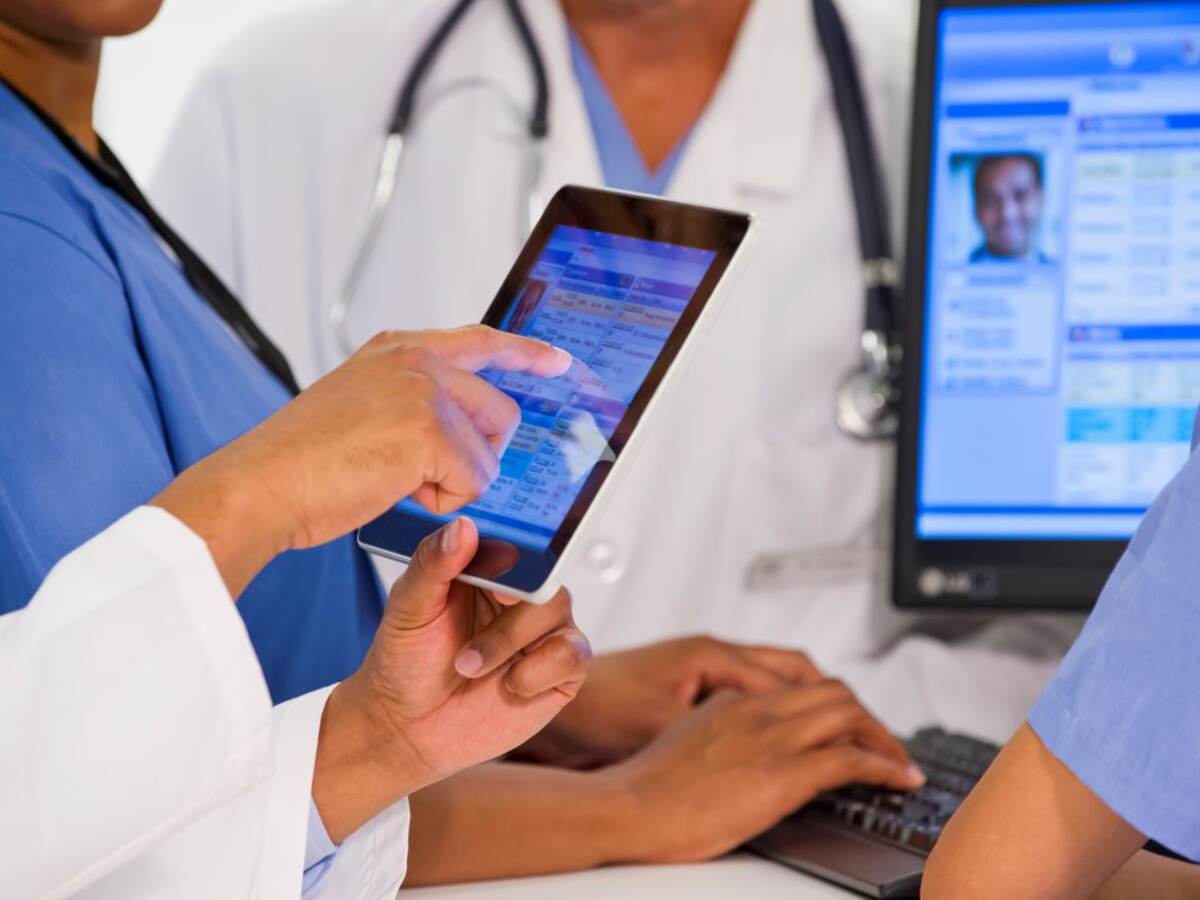 Medical workers with tablet and computer 