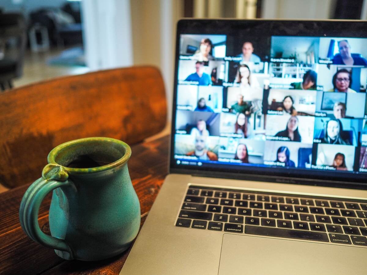 Computer with mug of coffee