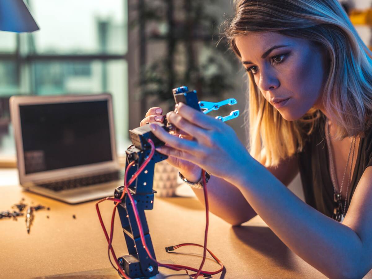 Person working in a robotics workshop