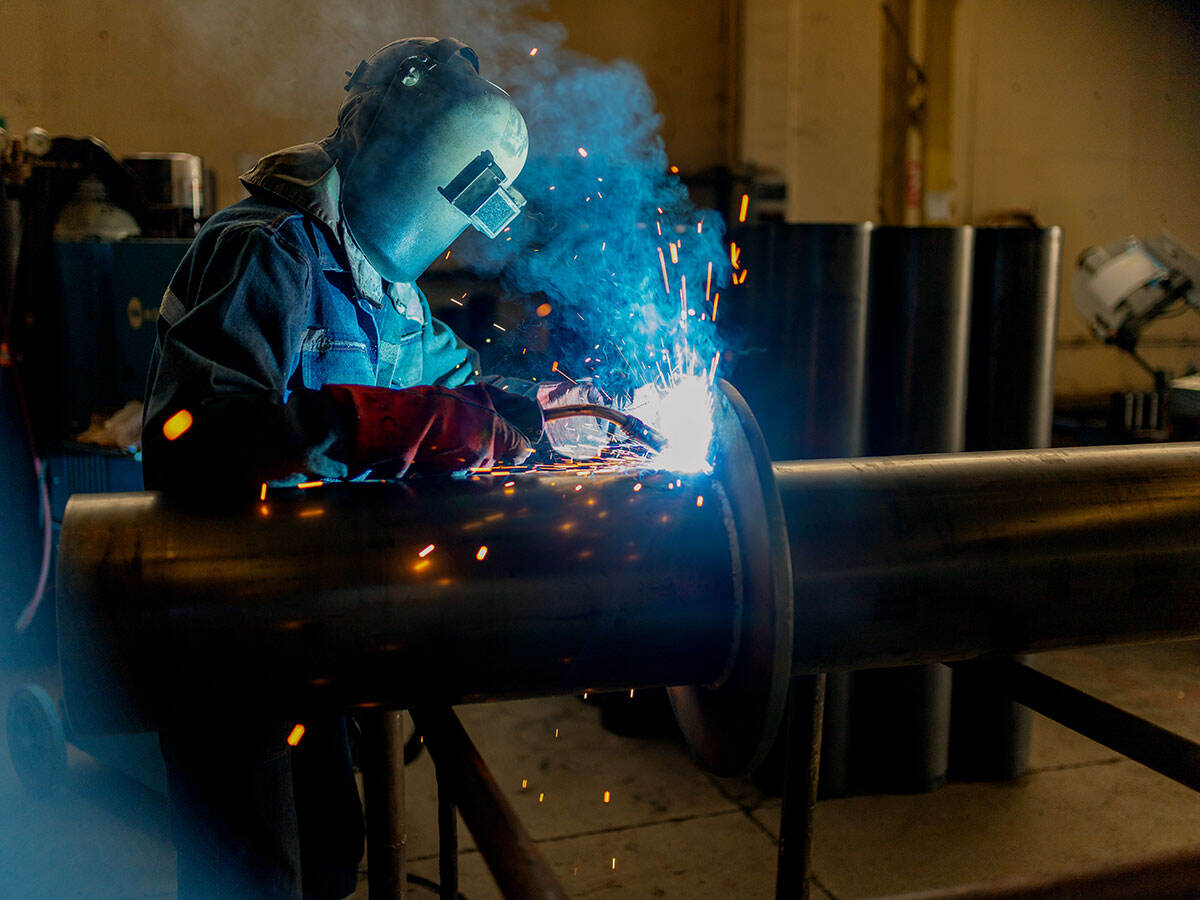 Welder working as sparks fly