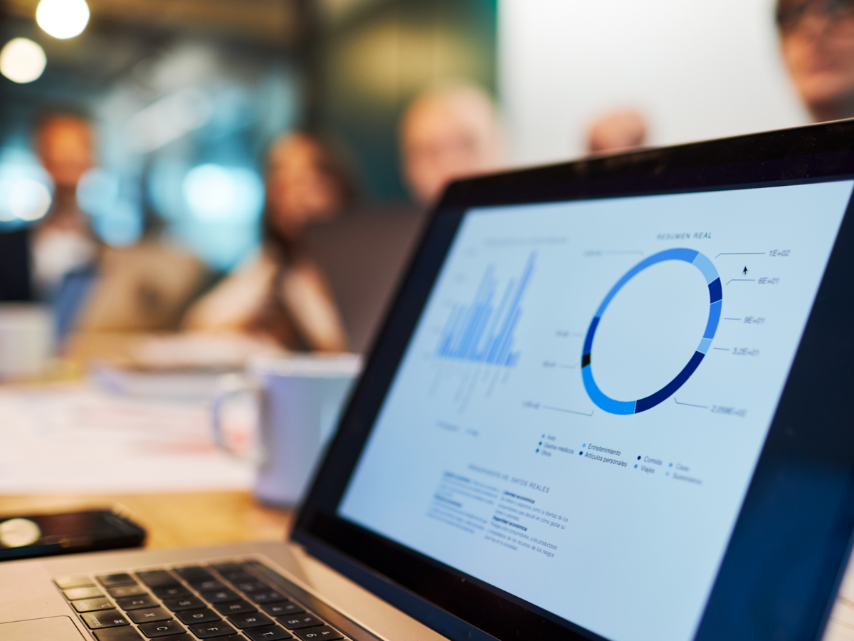 Close up view of a laptop with a business chart on the screen