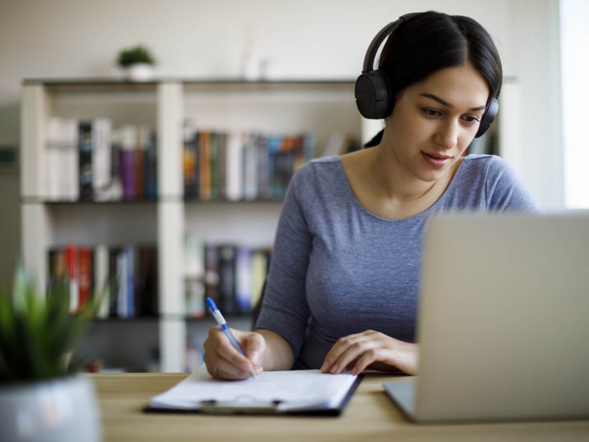 Woman in headset taking an e-learning course