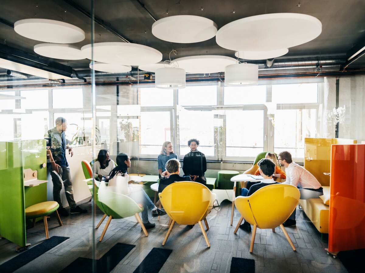 Young business professionals sitting on modern furniture