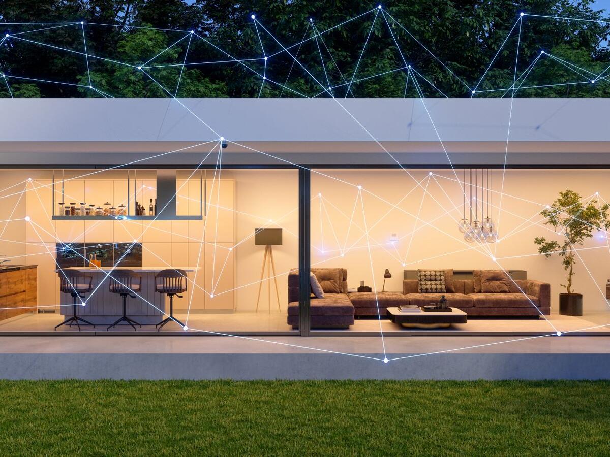 Modern home exterior with smart home control, mobile app and devices