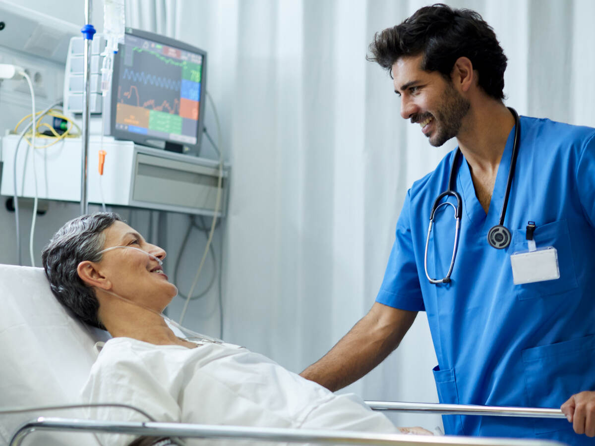 A nurse is attending to patient.