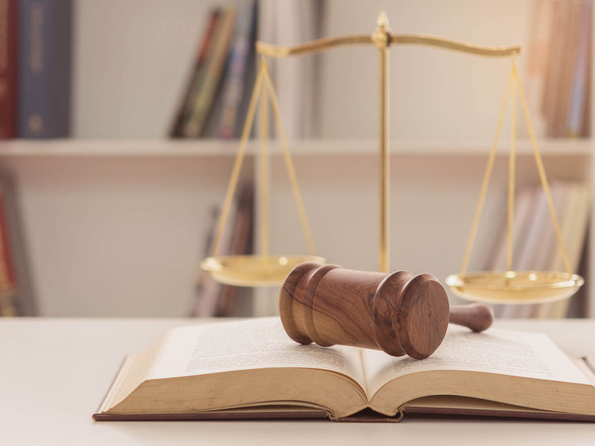 Gavel sitting on an open law book