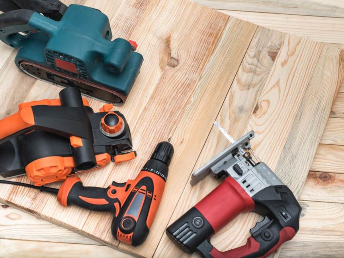 Power tools on planks of wood