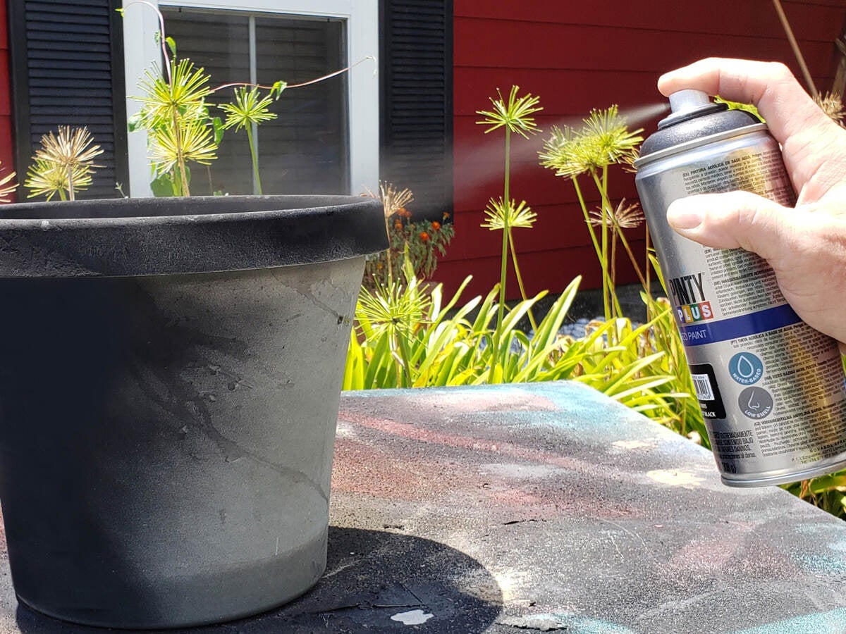 GREENGUARD-certified PintyPlus spray paint being applied to plant pot