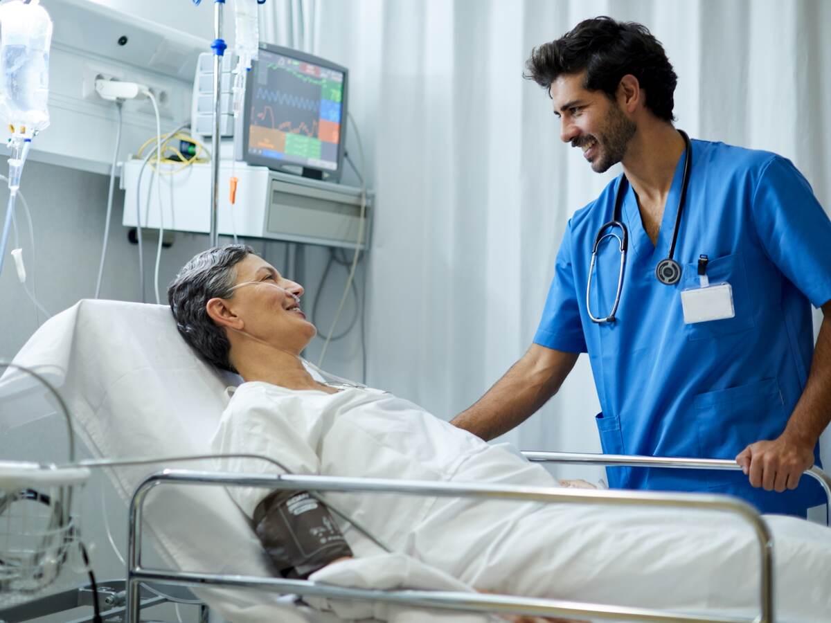 A nurse is attending to a patient.