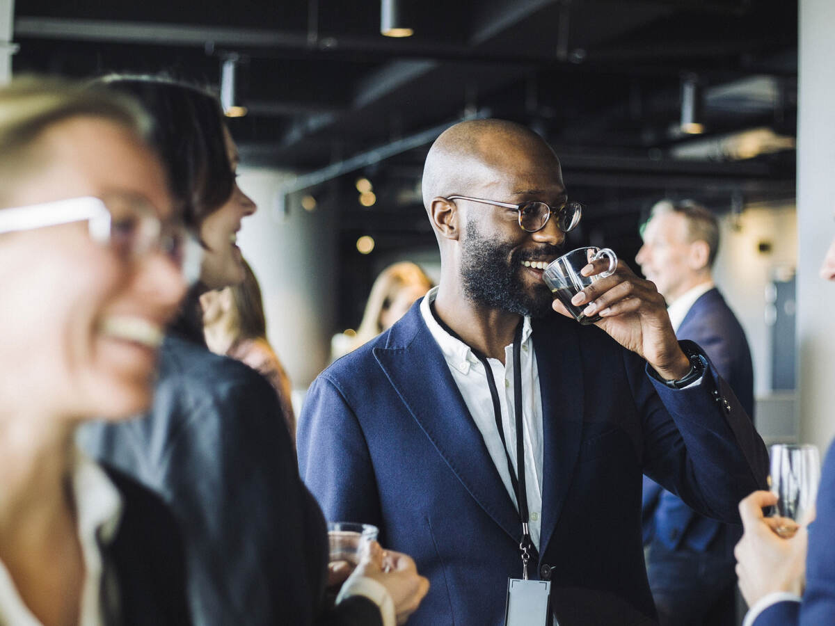 Person at event drinking coffee 