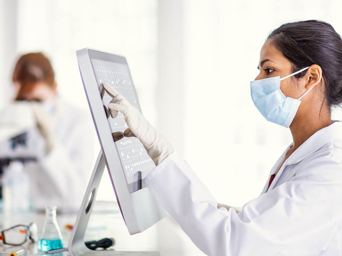 Scientist reviewing results on a computer