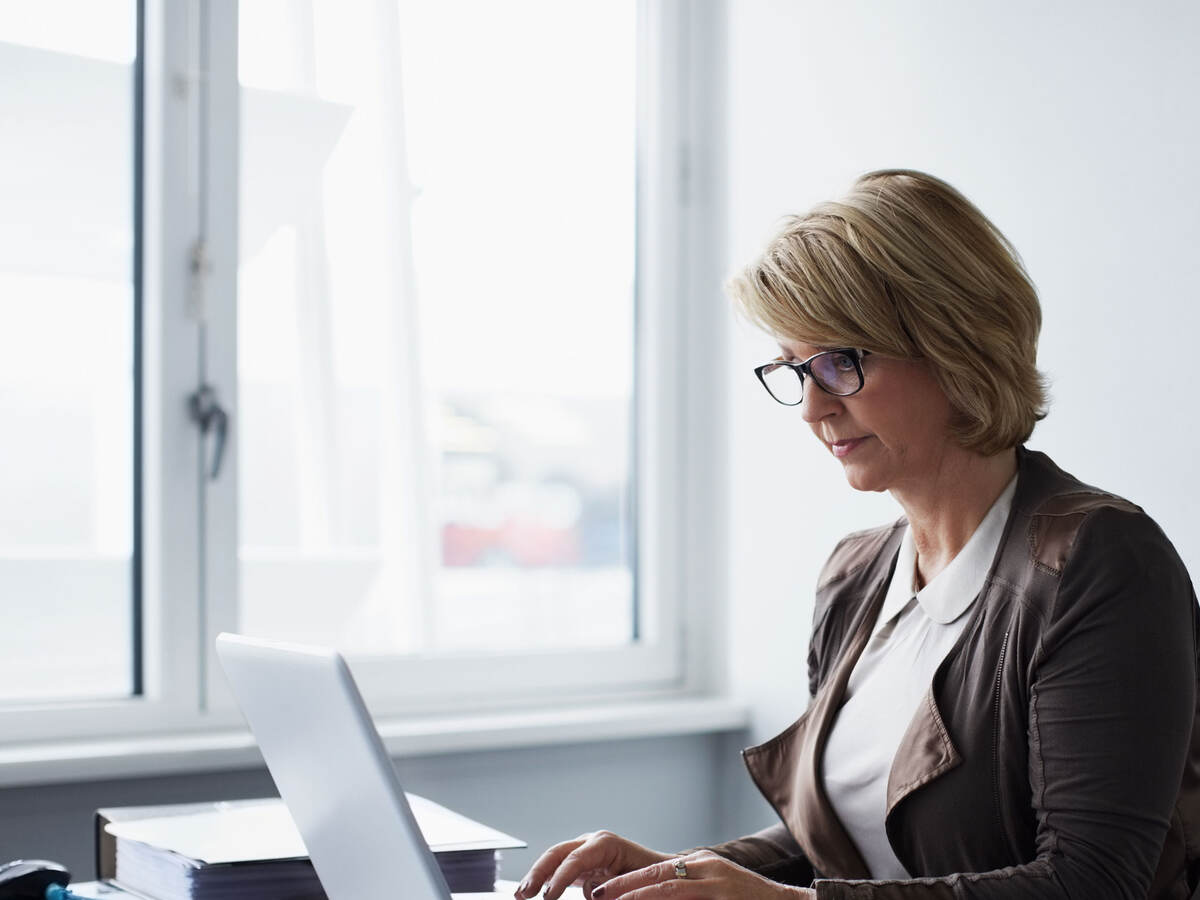 Business person using laptop