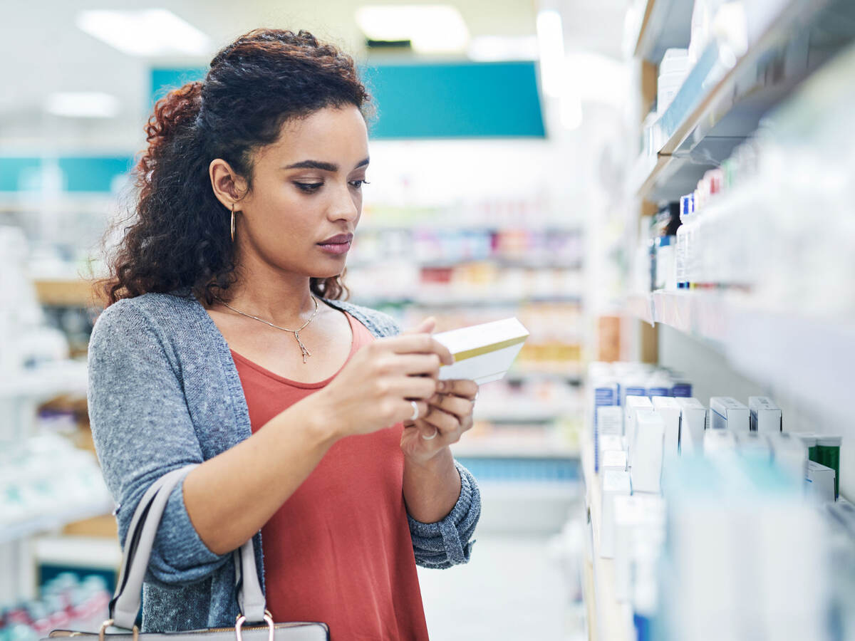 Shopper reading the ingredients on a product 