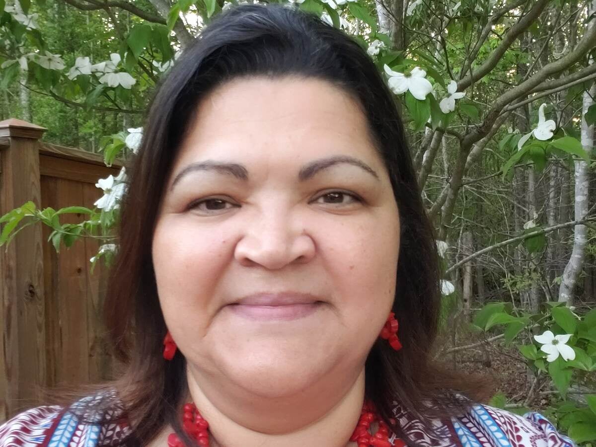 Closeup of La Tonya Locklear in colorful Lumbee shirt. 