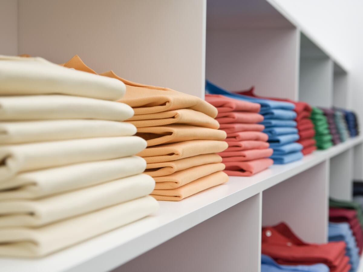 Colorful shirts at store.