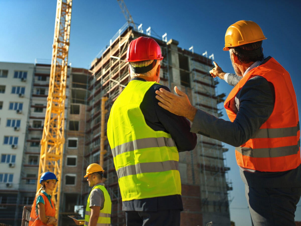 contractors supervising building process