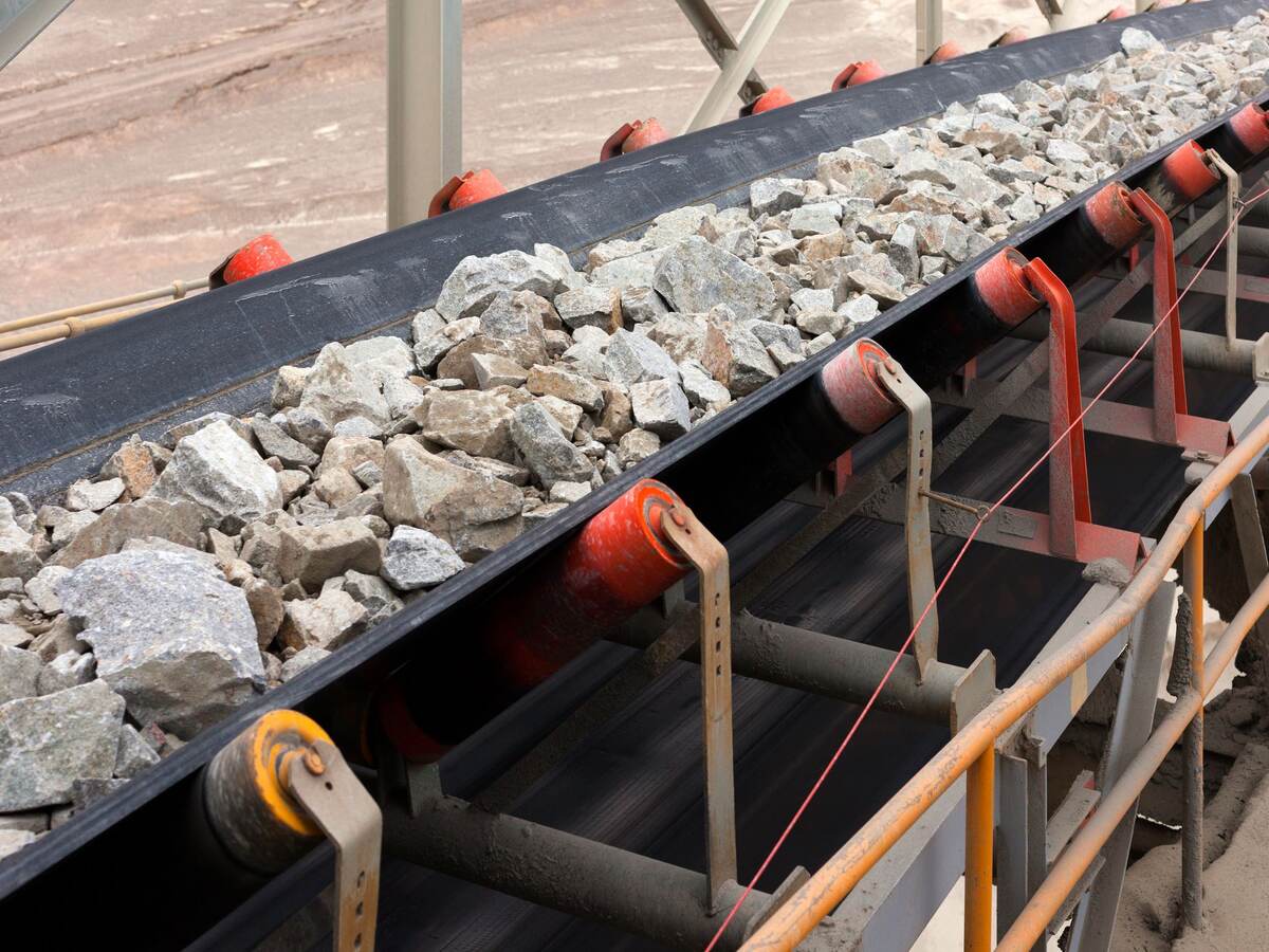 Raw material on conveyor belt before being crushed at copper mine in northern Chile.